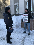 Vladimir Slivyak and a policemen at anti-coal protest in Novokuznetsk, Siberia