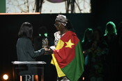 Lamiya Haji Bashar giving the Award to Marthe Wandou