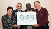Yacouba Sawadogo, Tony Rinaudo, Ivan Velasquez & Thelma Aldana with a picture of Saudi Laureates Abdullah al-Hamid, Waleed Abu al-Khair & Mohammad Fahad al-Qahtani
