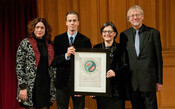 Deniz Ataç receiving the award on behalf of 2012 Laureate Hayrettin Karaca